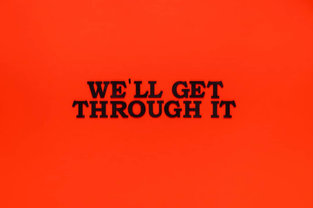 Motivational phrase on a bright red background to uplift and inspire.