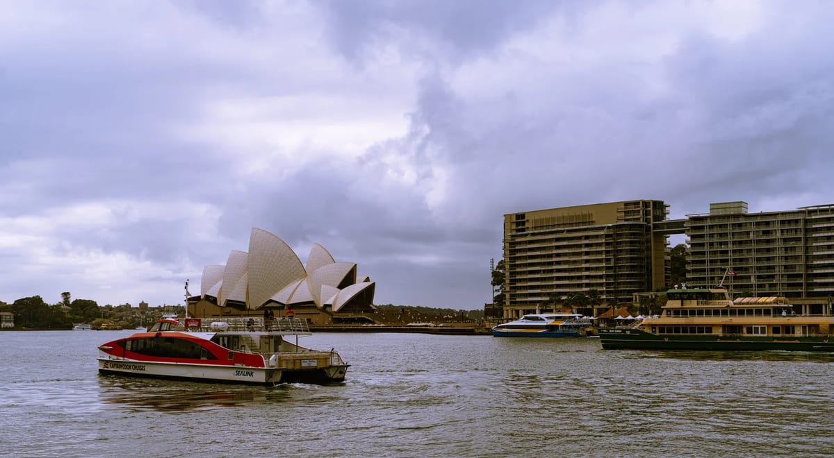 Sydney Opera House and the harbour under cloud