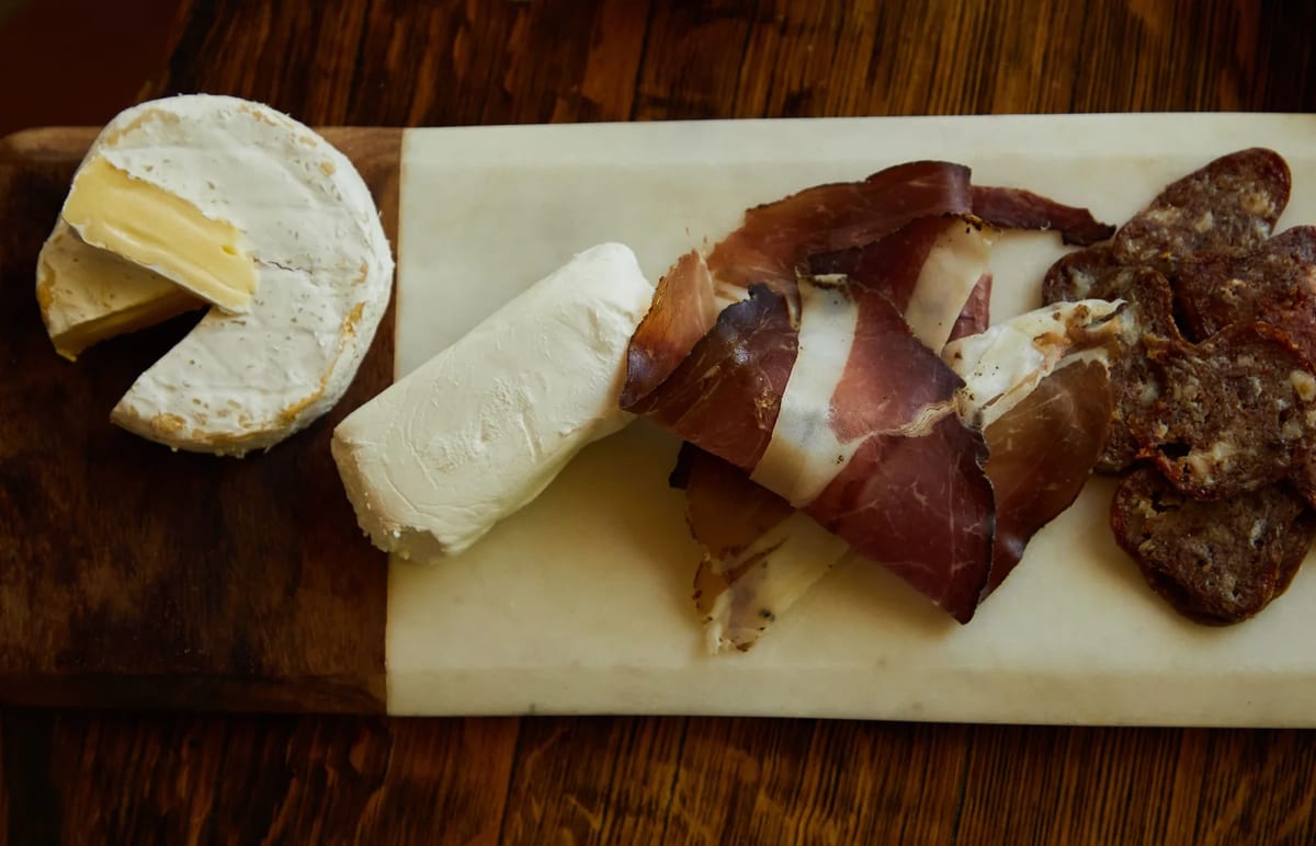 Board of camembert, goat cheese and cured meats, all banned as personal imports from the EU into Great Britain
