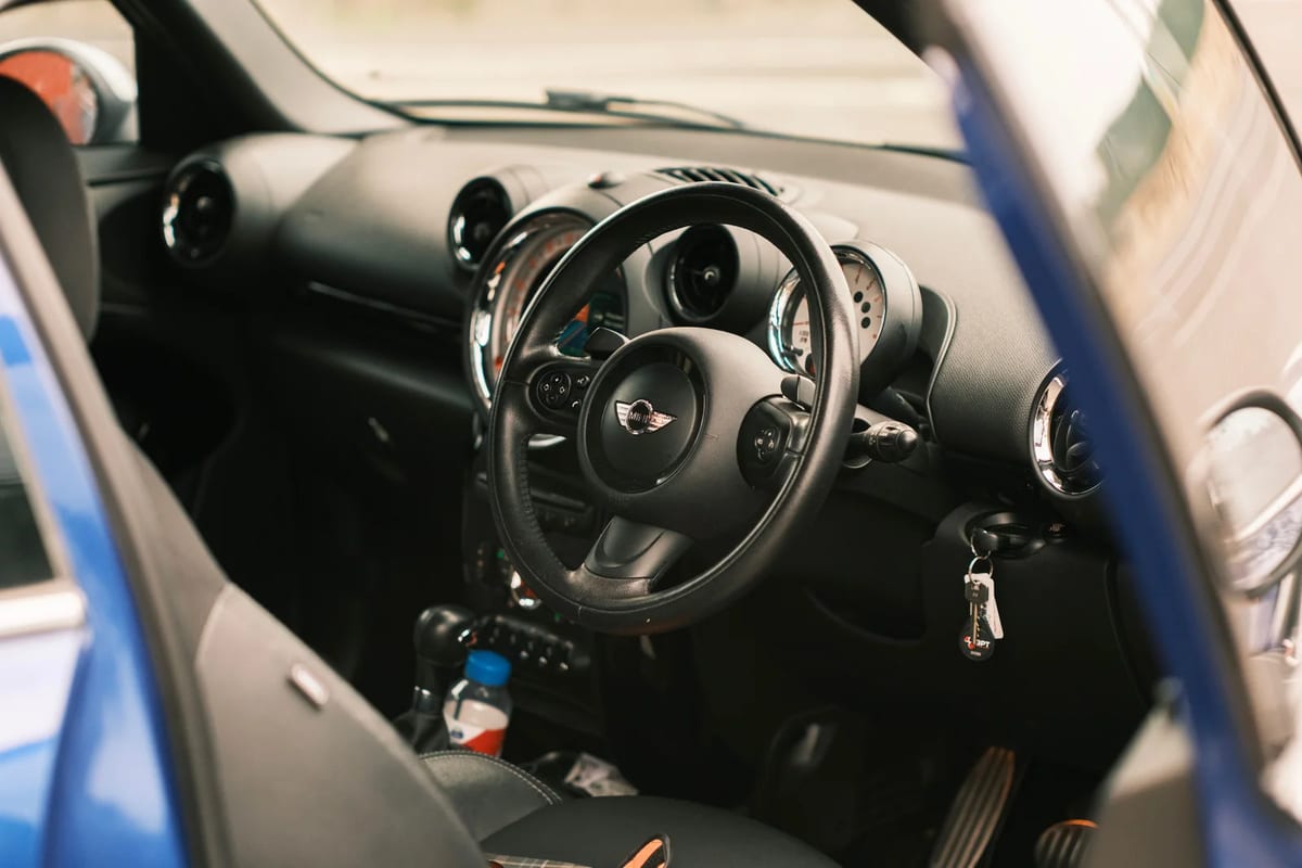 The dashboard and steering wheel of a right-hand-drive car