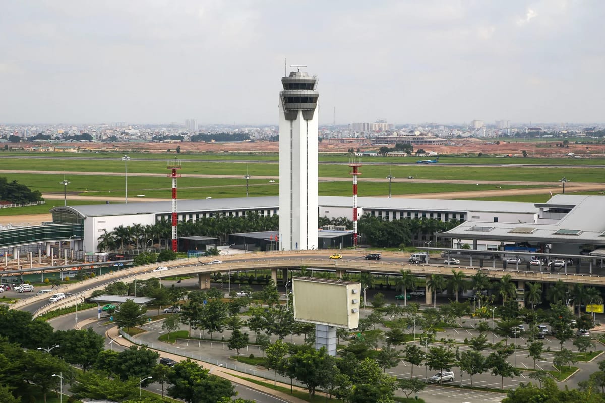 Aerial view of an airport with its control tower, terminal and runways