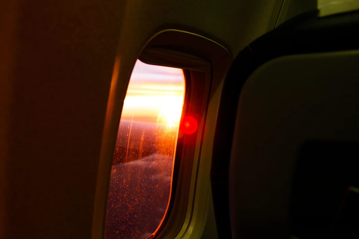 Sunset seen from an airplane window