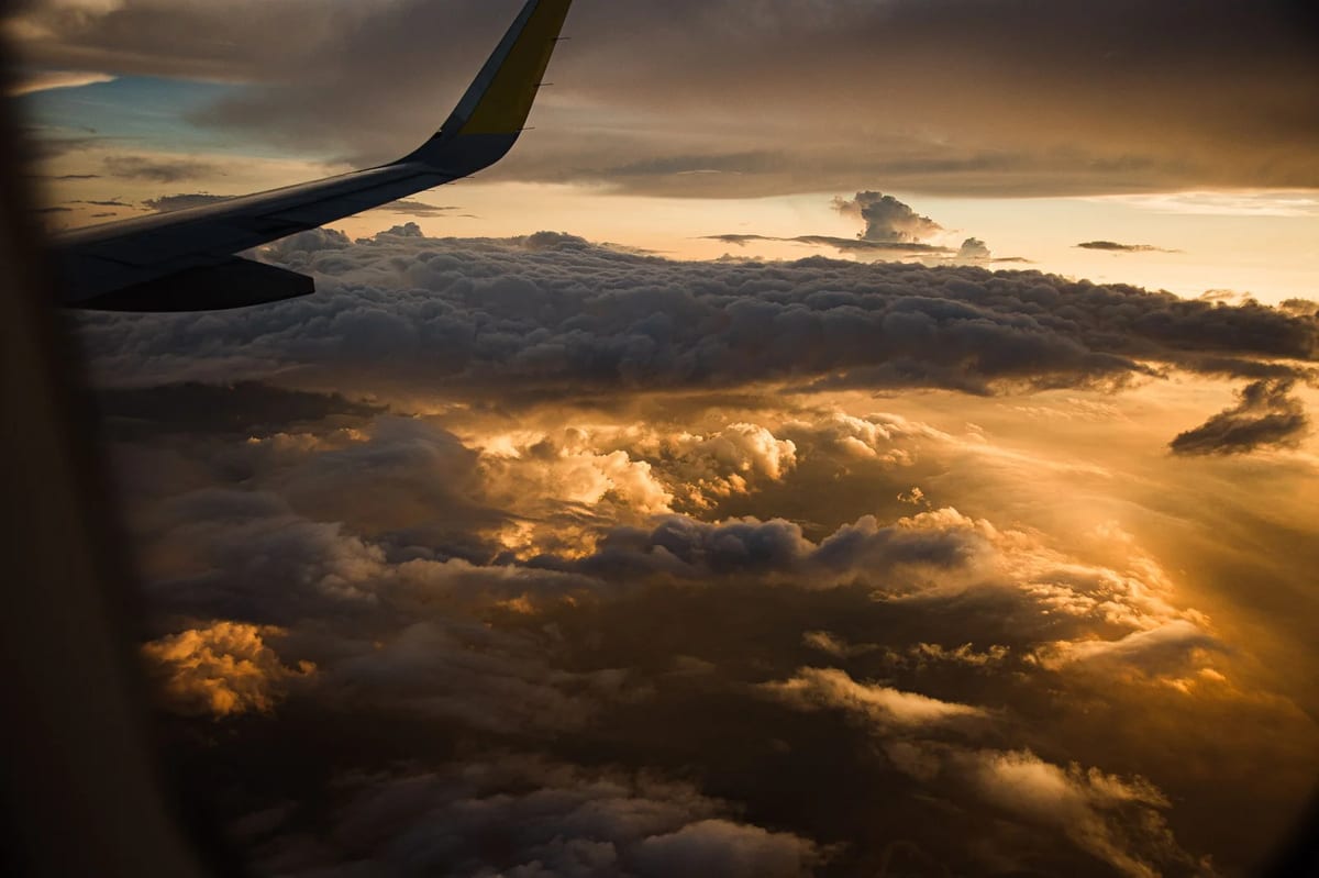 Clouds and sunset from an airplane window