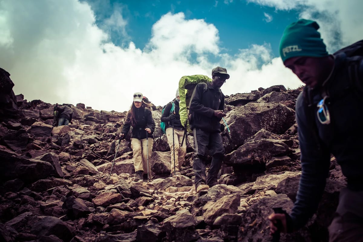 A group of hikers on a rocky mountain trail