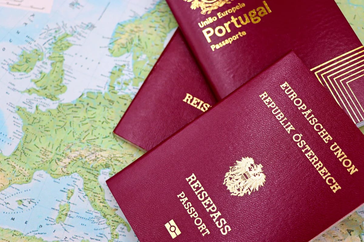 Two passports on a world map