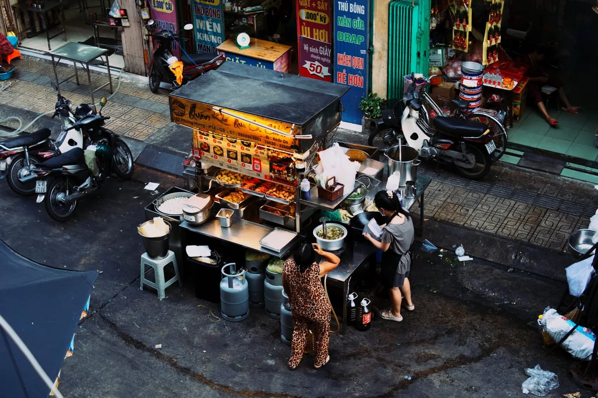 Women preparing food at a street food stall