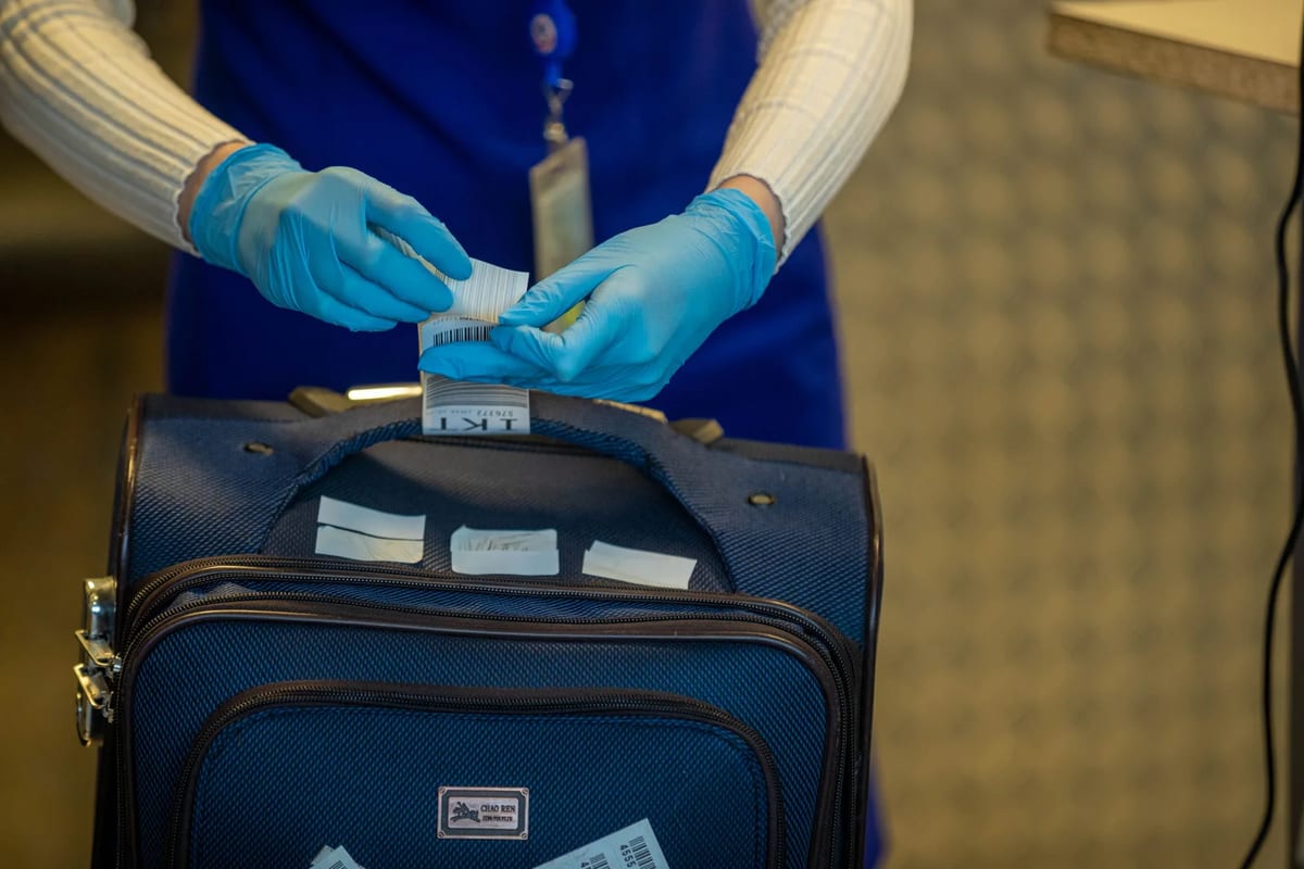 Close-up of airport security inspection