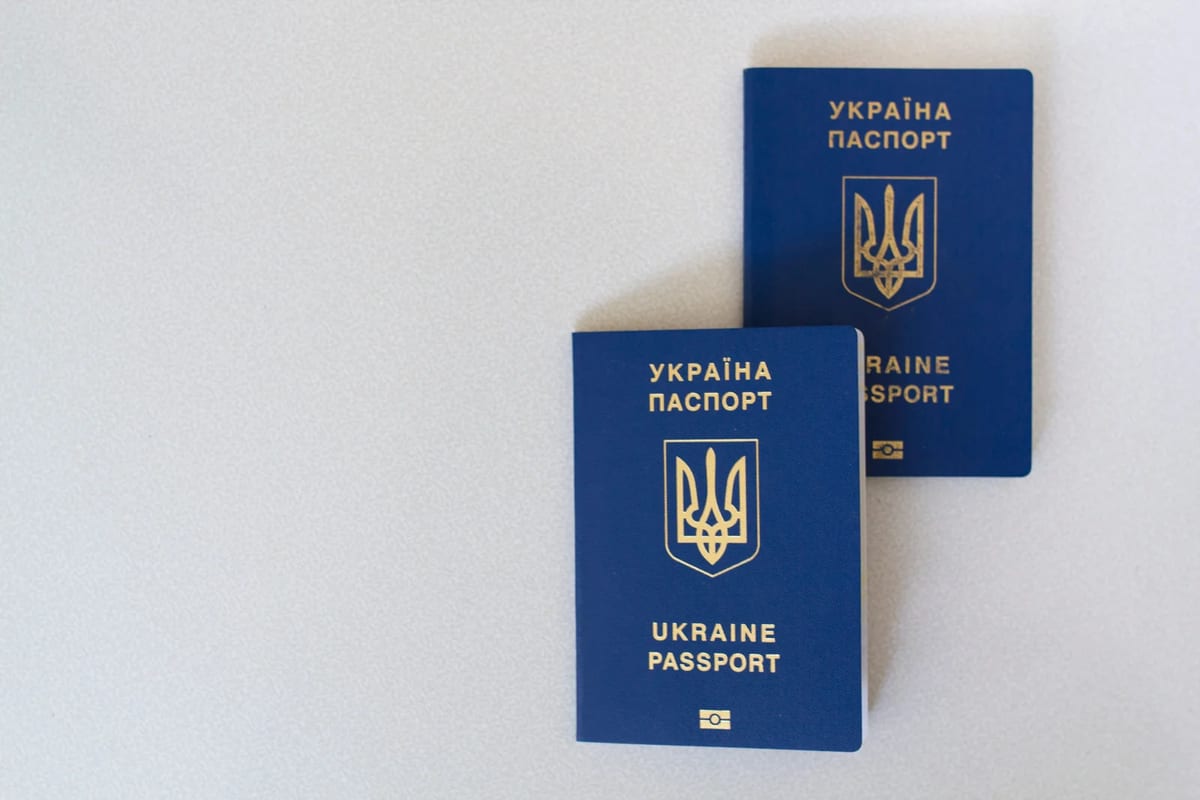 Two passports on a white surface