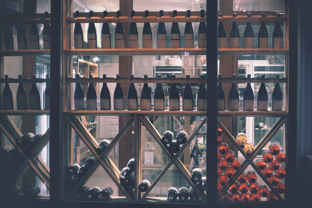Wine bottles on display in a market