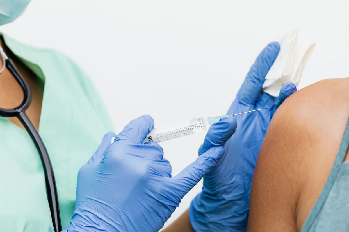 A vaccine being given in a clinic