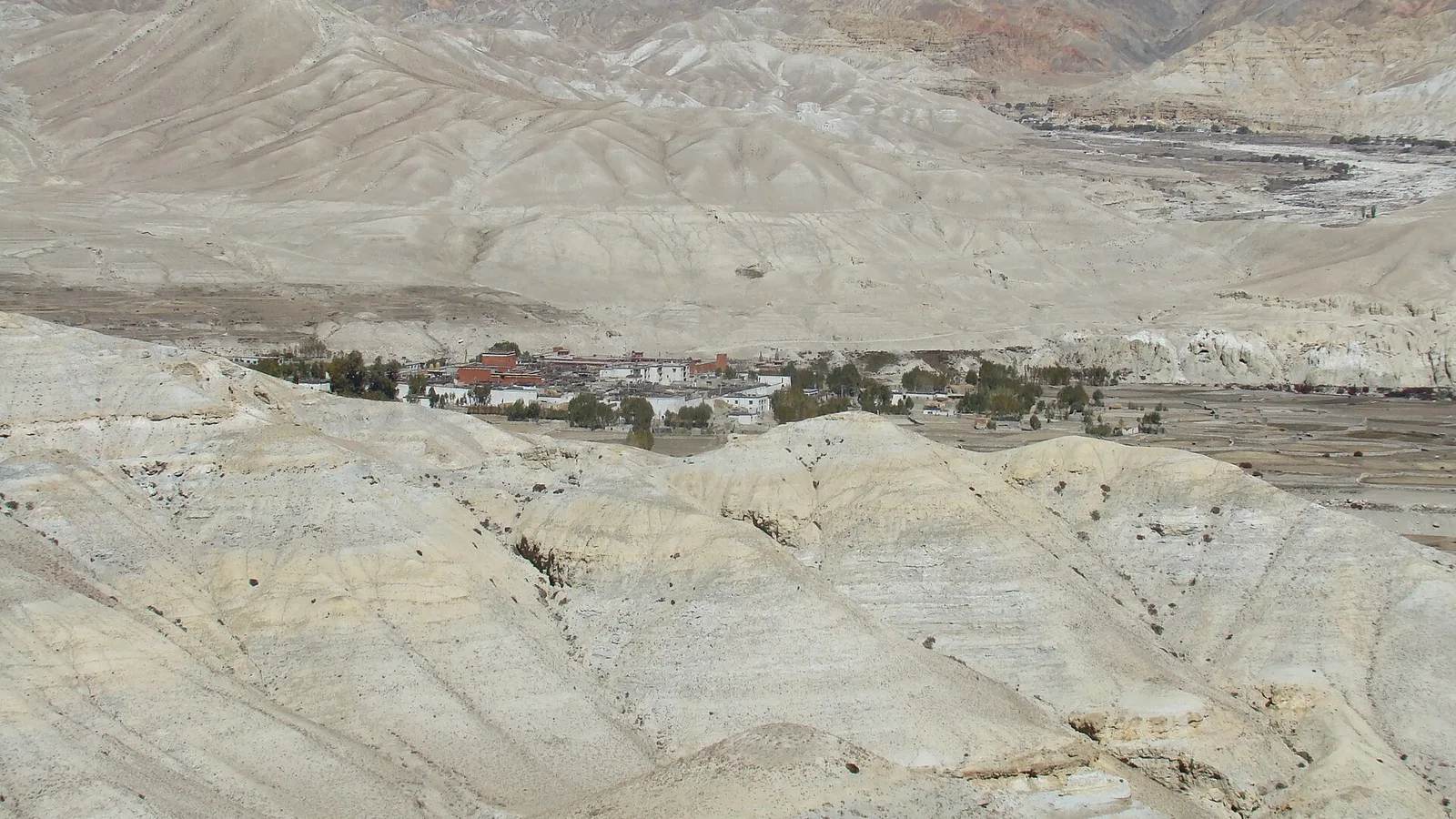 The walled town of Lo Manthang among the eroded desert hills of Upper Mustang