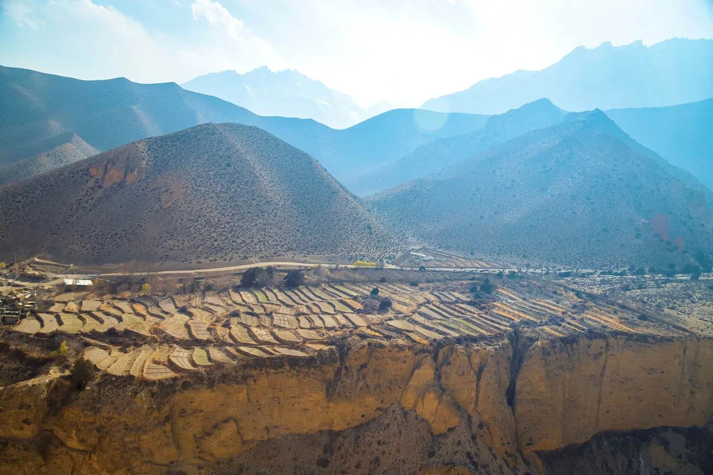 Desert canyons of Upper Mustang, Nepal's rain-shadow region, under clear summer skies