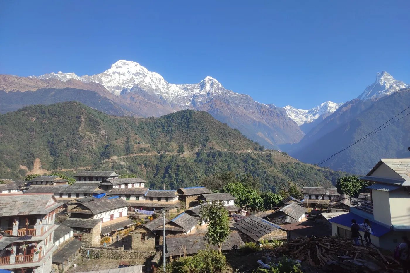Stone houses of Ghandruk Gurung village beneath the Annapurna range