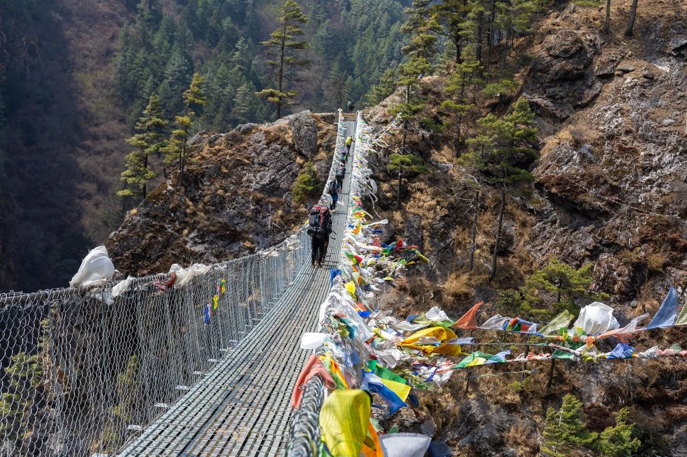a lone trekker on a Himalayan trail in Nepal