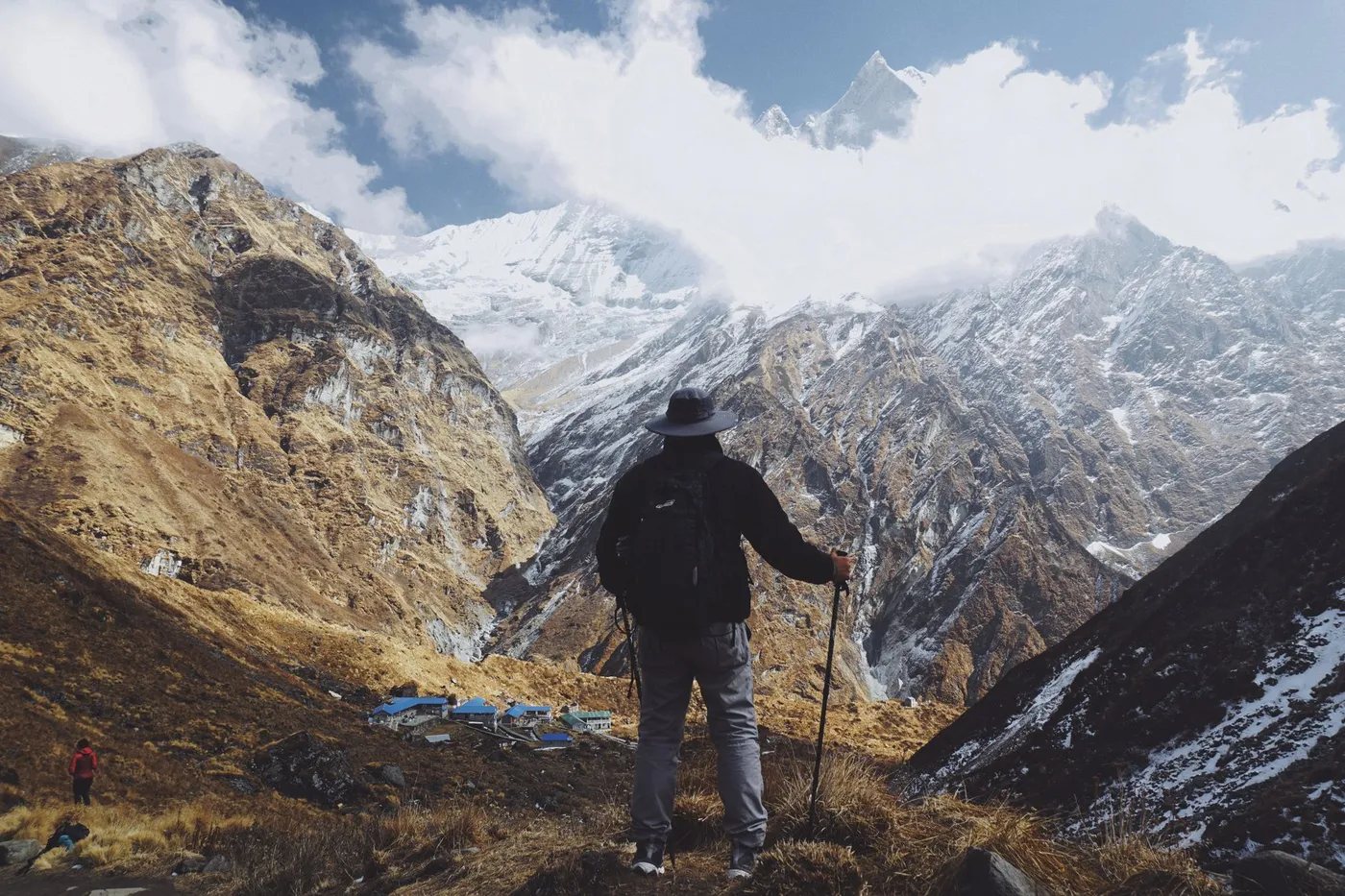 a trekker walking with a licensed guide in Nepal