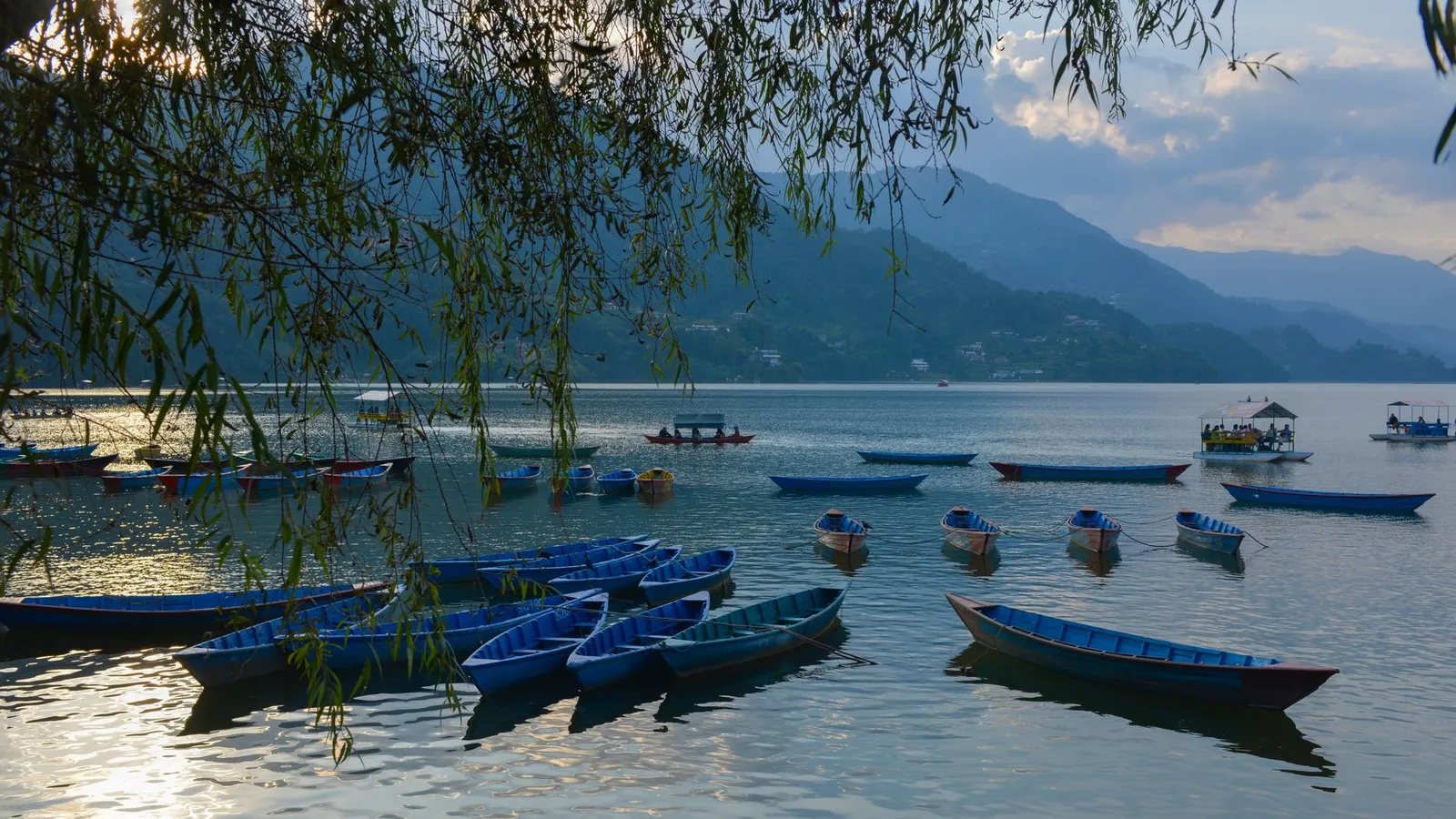 Yoga practice at sunrise overlooking the Himalayas in Pokhara, Nepal
