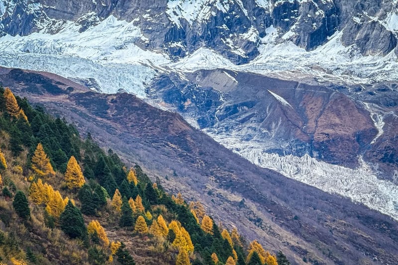 Manaslu range glowing gold at sunset in autumn